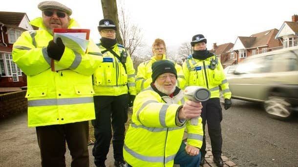 Volunteers and police working together as part of a Community Speed Watch scheme