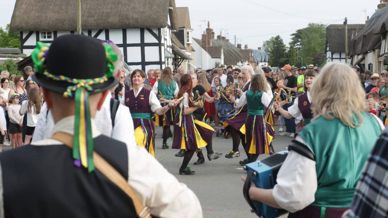 Offenham Wake crowds and dancers with cottages in the background